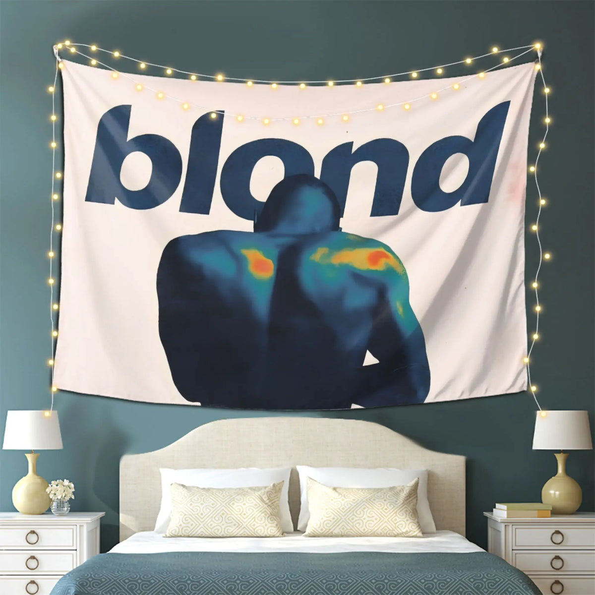 A tapestry featuring a silhouette of a person with blonde hair against a light background, illuminated by string lights.