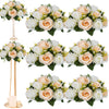 A floral arrangement featuring roses in shades of cream and peach, presented as a centerpiece.