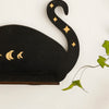 A black wall shelf featuring a silhouette of a cat with crescent moon accents.