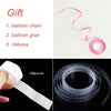 Kit for making a balloon garland arch including a balloon chain, glue, and ribbons