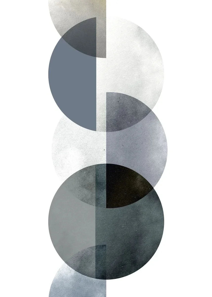 Minimalist wall art featuring stacked circles in shades of gray and black on a white background.