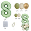 A set of vintage number balloons in sage green and champagne gold, including large foil numbers and smaller latex balloons.