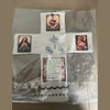 Handcrafted pocket shrine featuring a cross and religious imagery on a white fabric background.