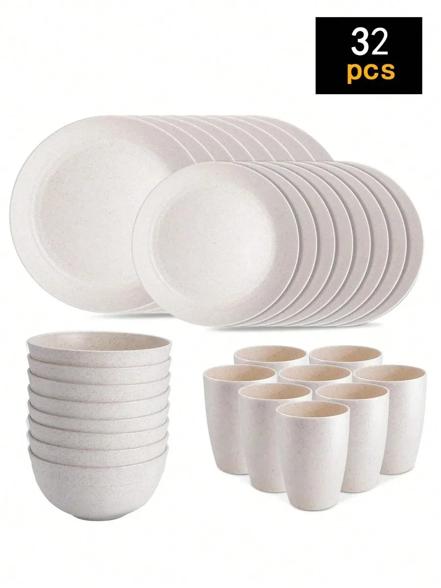 A set of 32 white reusable plastic tableware items including plates and cups.