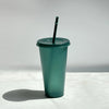 A green glitter party cup with a black straw is shown against a white background.
