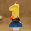 A birthday candle shaped like a construction excavator, featuring a yellow and orange vehicle on a blue base.