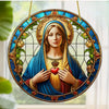 A circular acrylic suncatcher featuring a depiction of the Virgin Mary with a halo and roses.