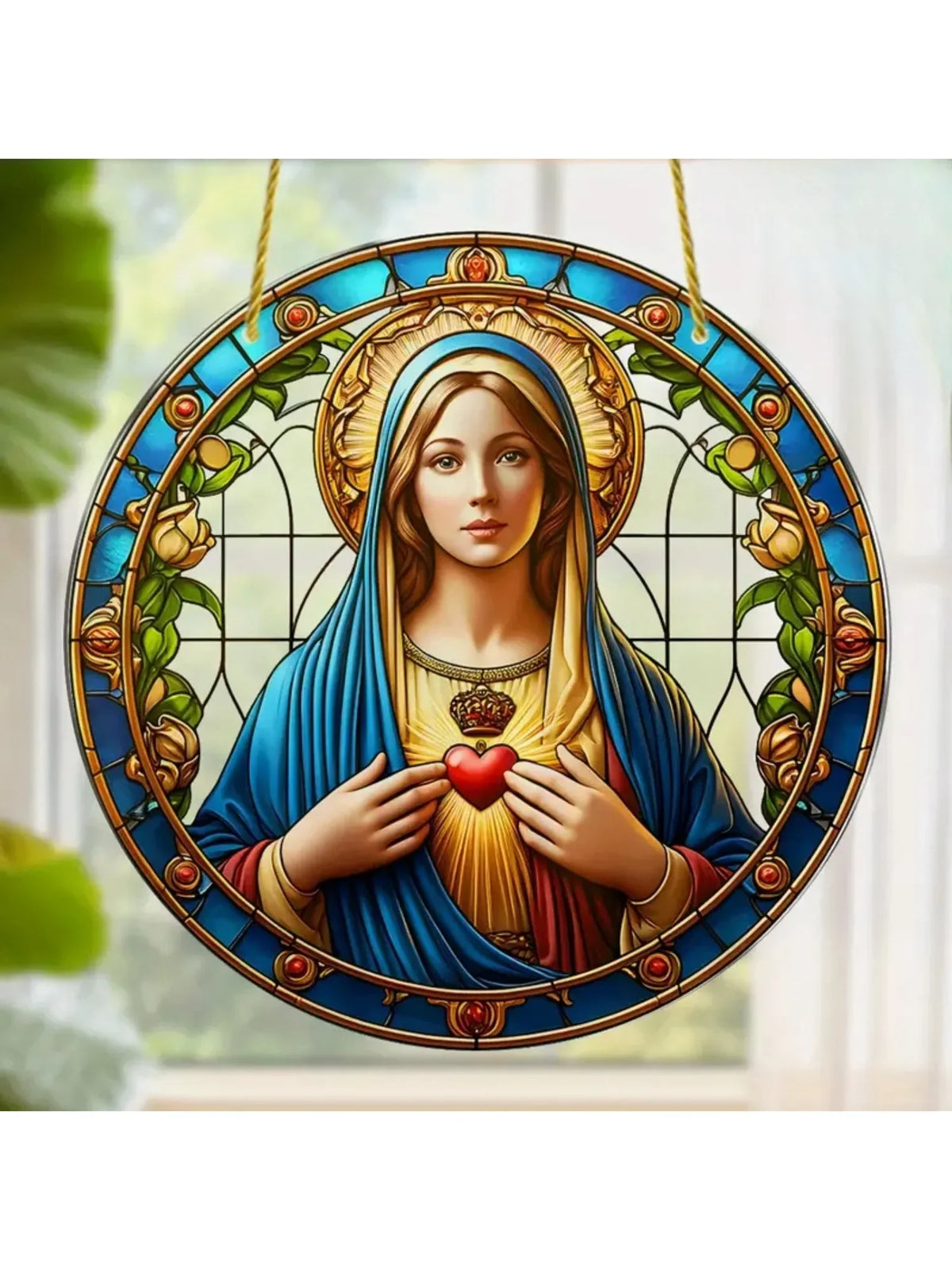 A circular acrylic suncatcher featuring a depiction of the Virgin Mary with a halo and roses.