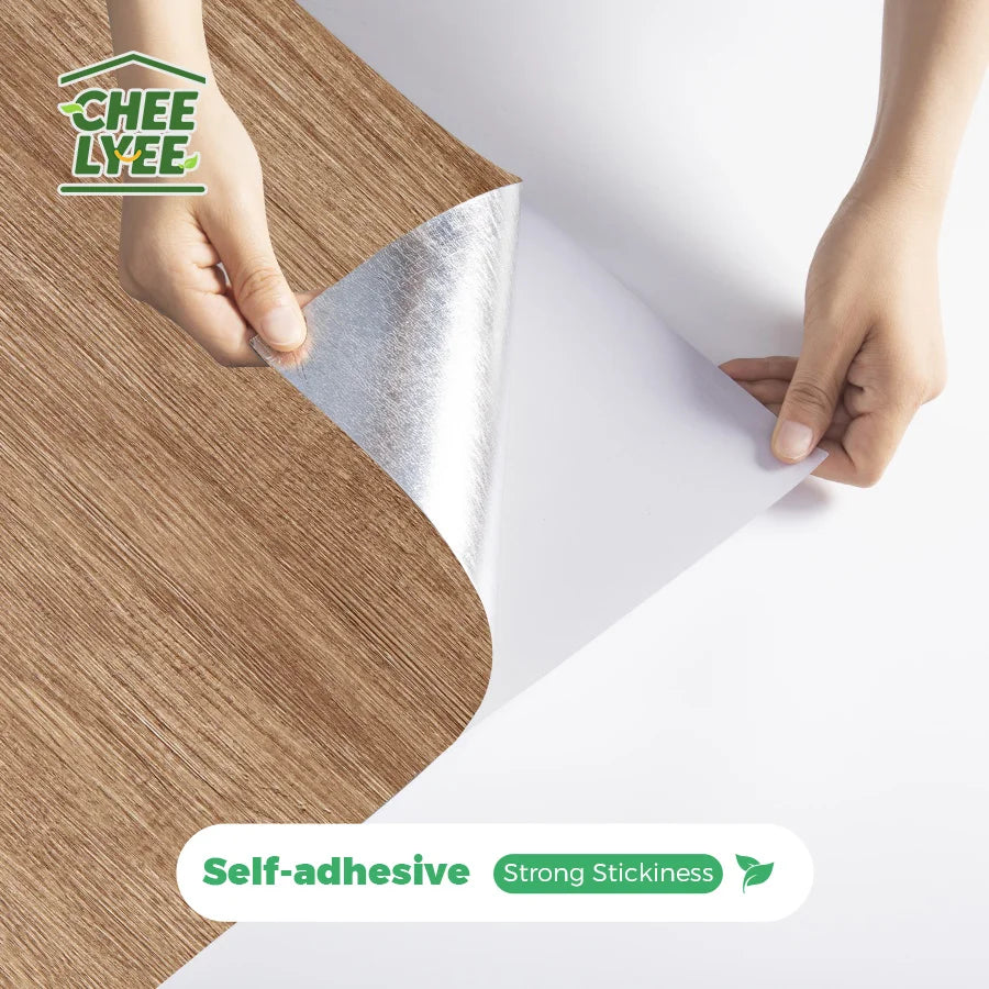 Hands peel and stick wood grain wall tiles onto a surface, demonstrating self-adhesive strong stickiness.