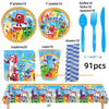 A set of birthday party decorations including plates, napkins, cups, straws, and a banner featuring cartoon characters.