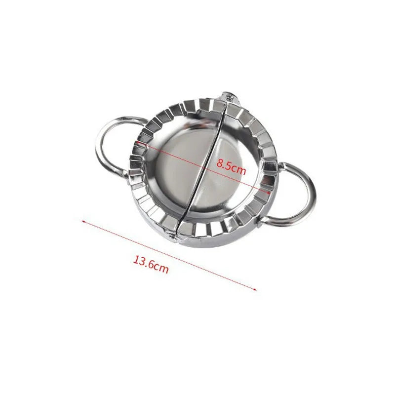 Stainless steel dumpling maker with a crimped edge shown from above.