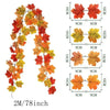 Artificial autumn maple leaf vine wreath featuring red, orange, and yellow leaves.