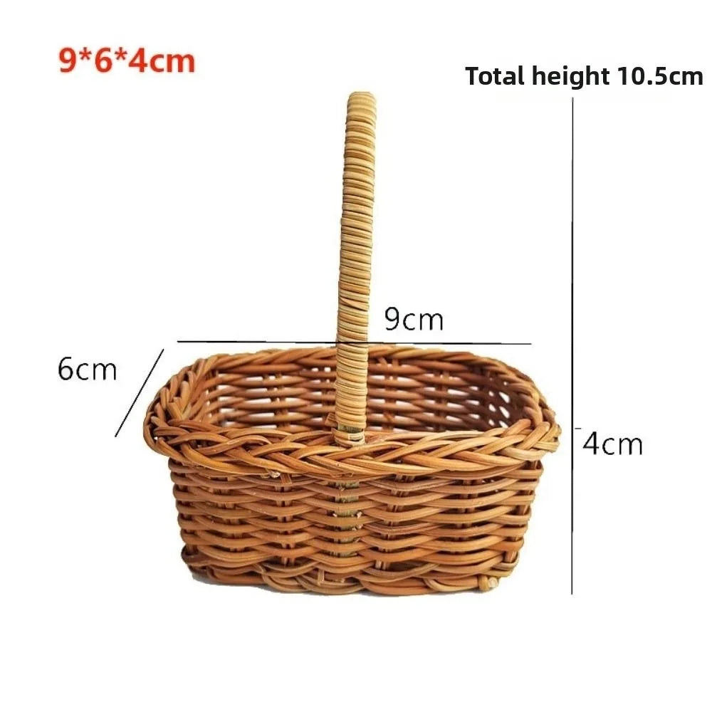 A handwoven rattan storage basket with a handle, measuring 9x6x4 cm.