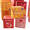 A collection of colorful pop-up surprise gift boxes in orange, pink, and red packaging.