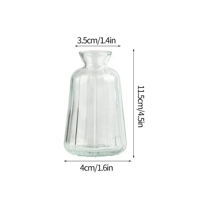 A clear glass vase with a cylindrical body and a narrow neck, shown in a side view.