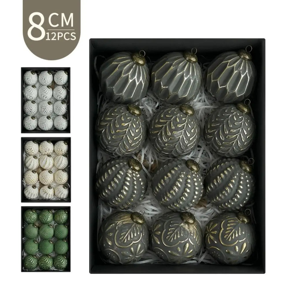 A set of twelve metallic green and gold retro shatterproof Christmas tree ball ornaments displayed in a black box.