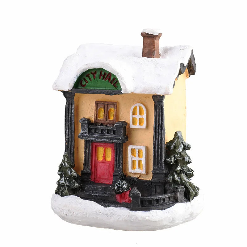 A festive Christmas house night light depicting a yellow building with a green roof and warm LED glow.