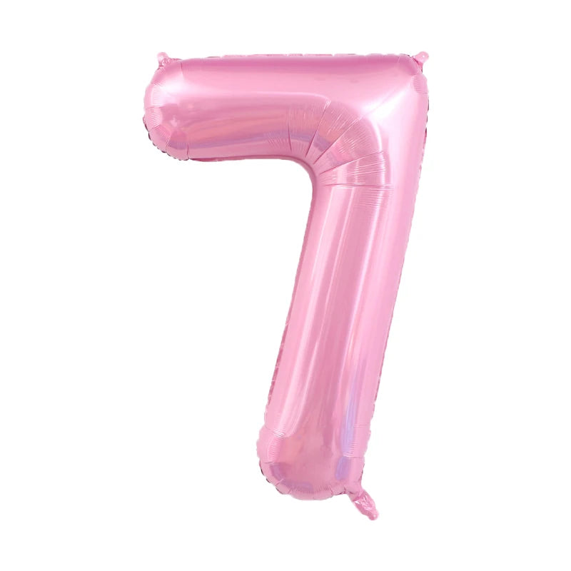 A pink foil number balloon shaped like the number 7.