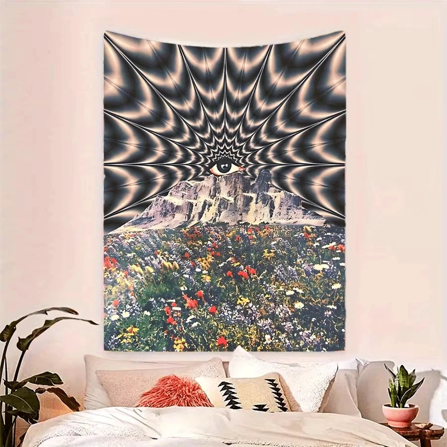 A wall tapestry featuring a psychedelic eye radiating light over a mountain landscape covered in colorful flowers.