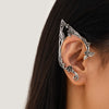 Silver elf flower leaf clip earrings worn on a woman's ear.