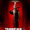 A movie poster featuring a menacing clown character in a dark, red-lit hallway.