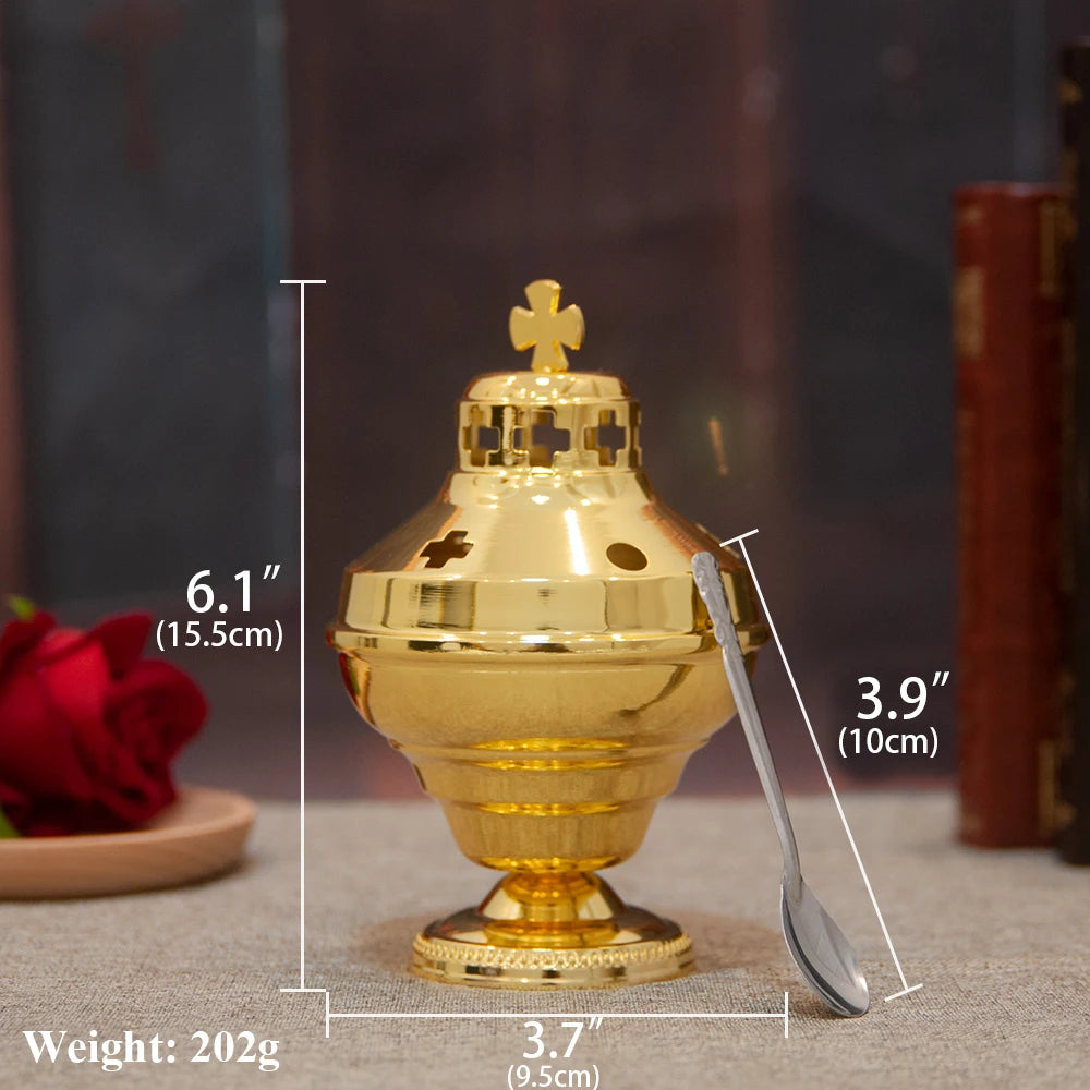 Gold-plated Orthodox censer with bells shown on a surface.
