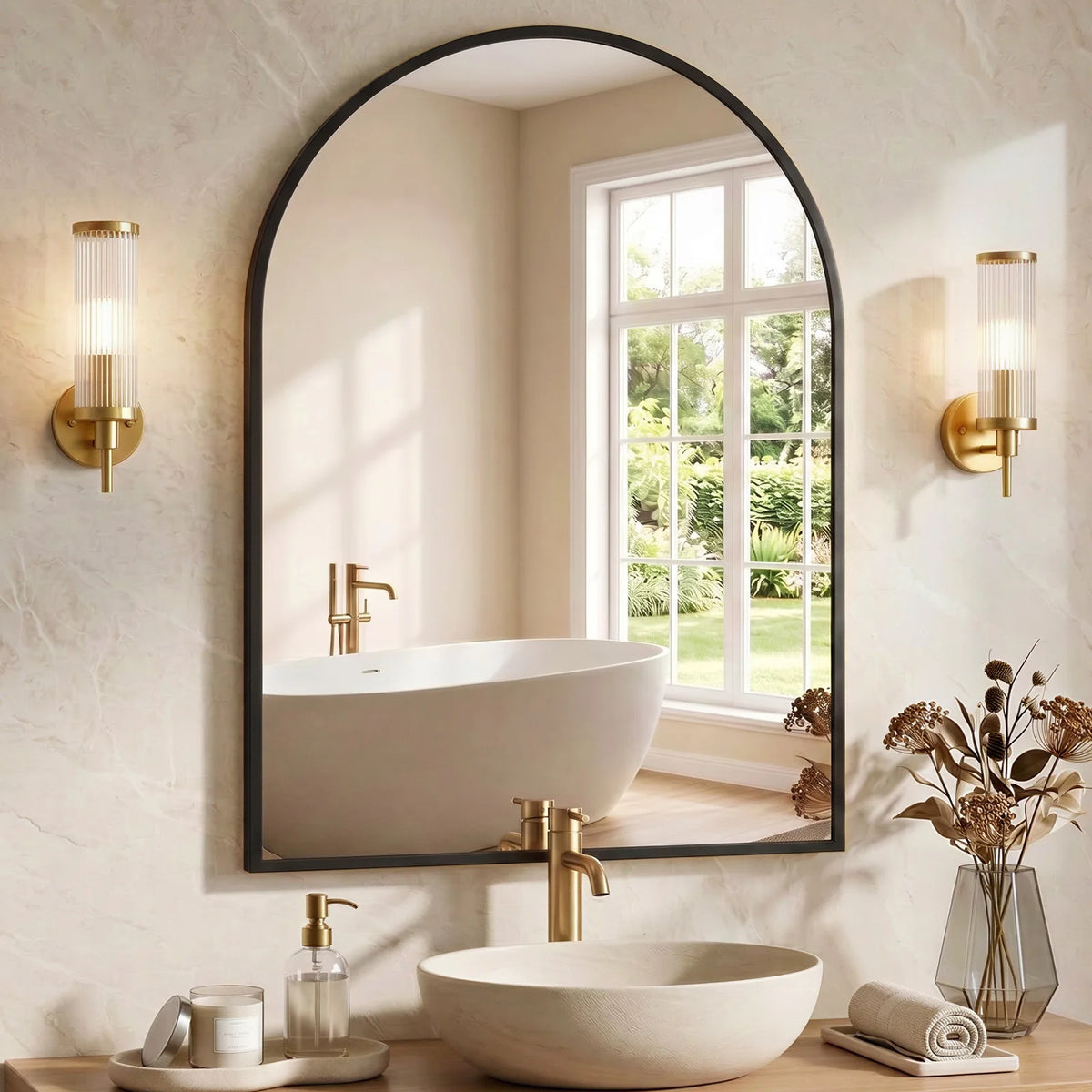 A modern bathroom featuring an arched mirror above a vessel sink and a white ceramic vessel sink on a wooden counter.