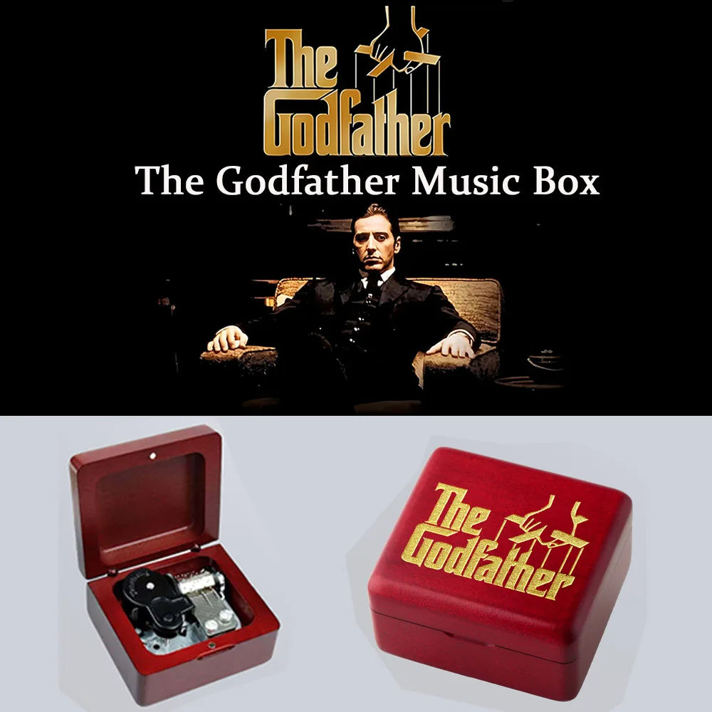 A red music box featuring a gold-colored design of The Godfather logo and hands.