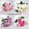 A collection of five artificial roses in various shades of pink and white, including silk roses and peonies, arranged for dec