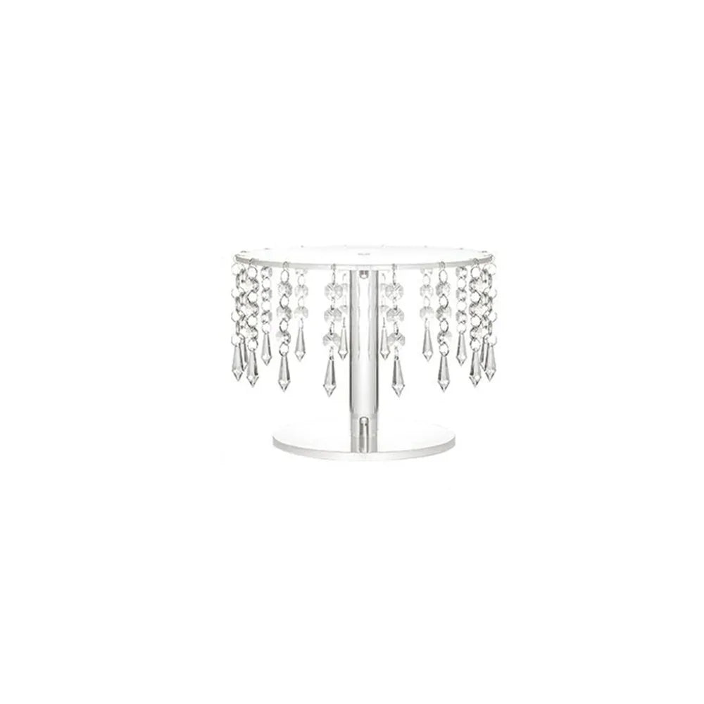 Elegant transparent acrylic cake display rack with dangling clear crystals.