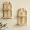 Two wooden wall shelves with arched, ribbed designs mounted on a light-colored wall.