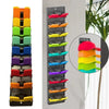 A wall-mounted hat organizer rack with multiple colored slots for storing hats.