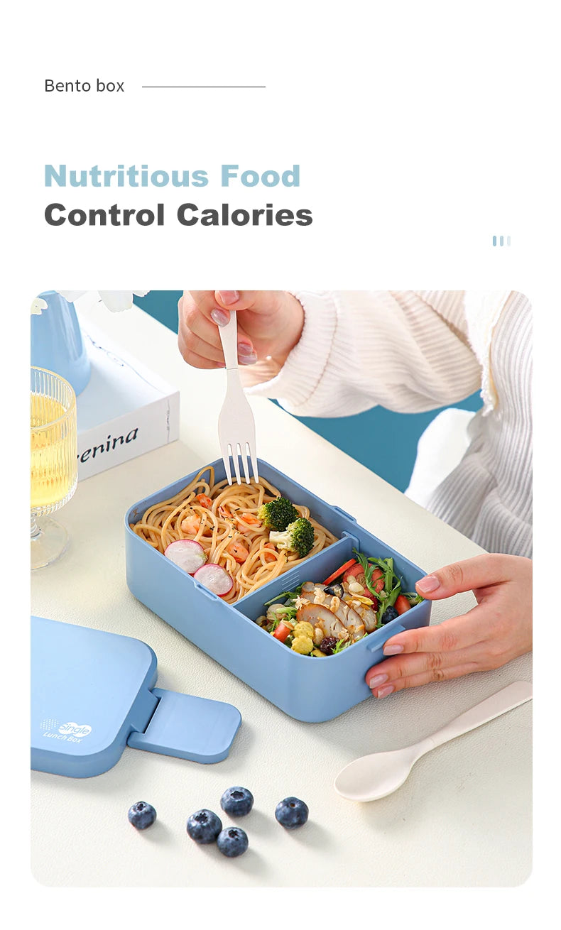 A blue bento box filled with stir-fried food and bamboo utensils on a white table.
