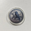 A challenge coin featuring a gothic crow, skull, and text that reads Memento Meh I Don't Care.