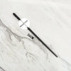 A black metal magic wand replica with a metal core is displayed on a white marble surface.