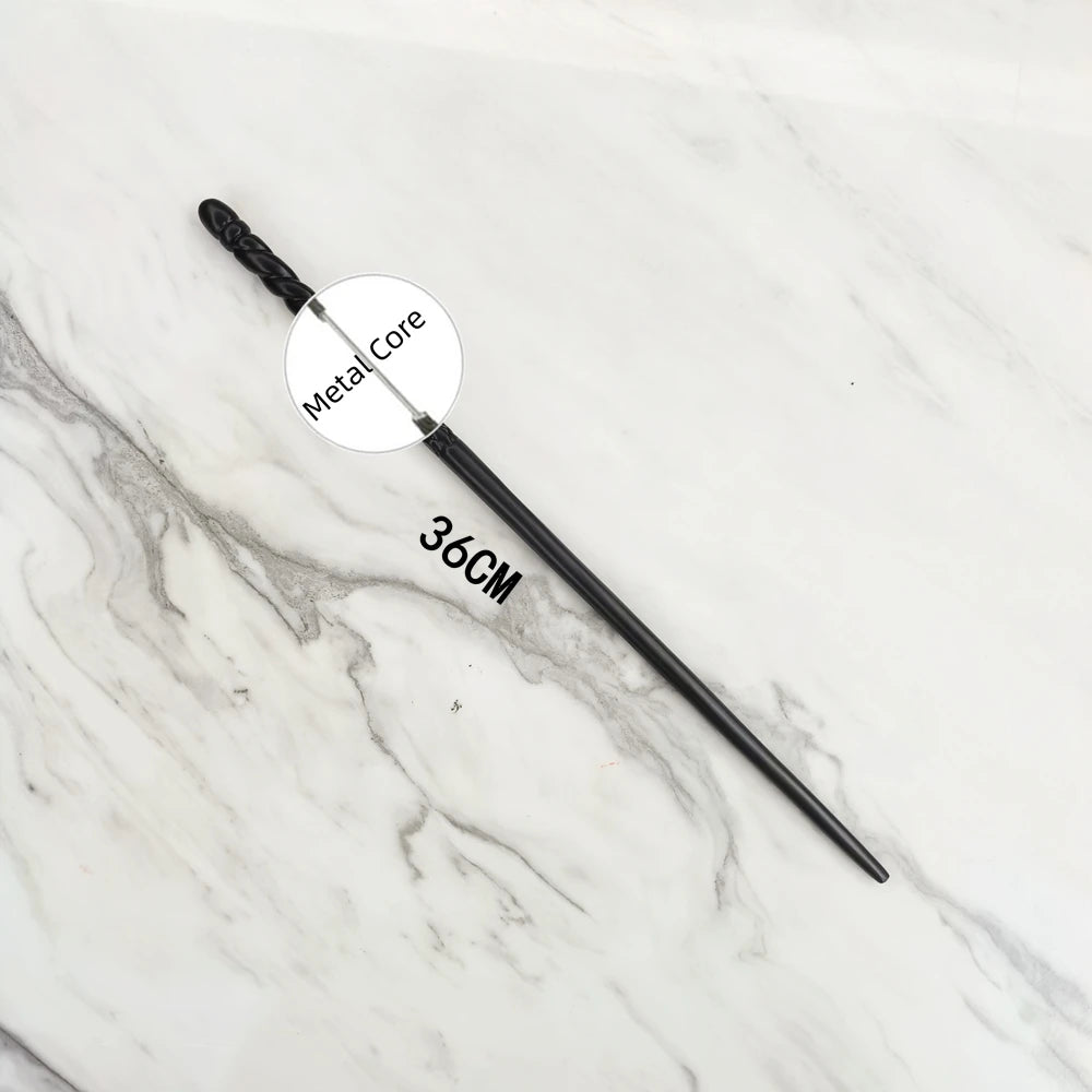 A black metal magic wand replica with a metal core is displayed on a white marble surface.