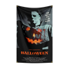 A black flag featuring a ghostly image of Michael Myers with glowing orange eyes and Halloween text.