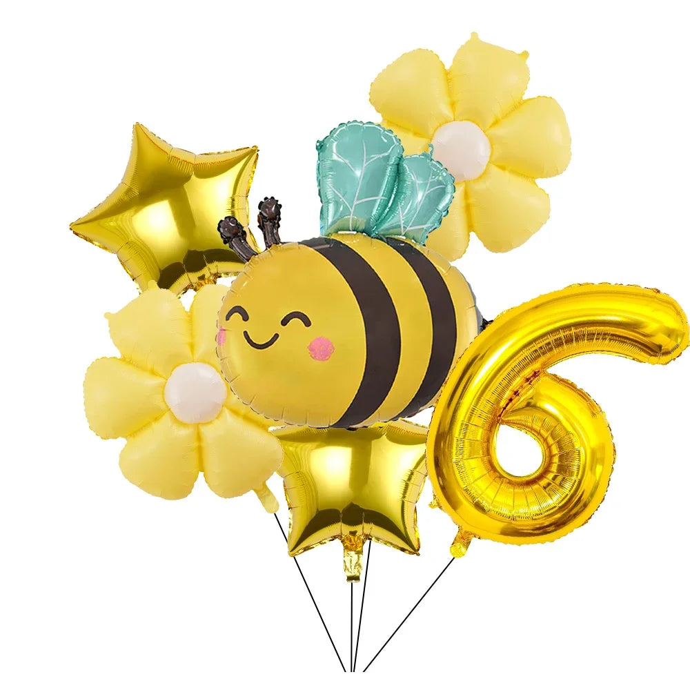 A set of six yellow and light green aluminum foil daisy balloons shaped like a bee and the number six for parties
