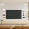 A modern white five-tier vertical wall shelf displaying various decorative items and books above a television.
