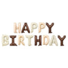 A set of thirteen rose gold foil balloons spelling out Happy Birthday