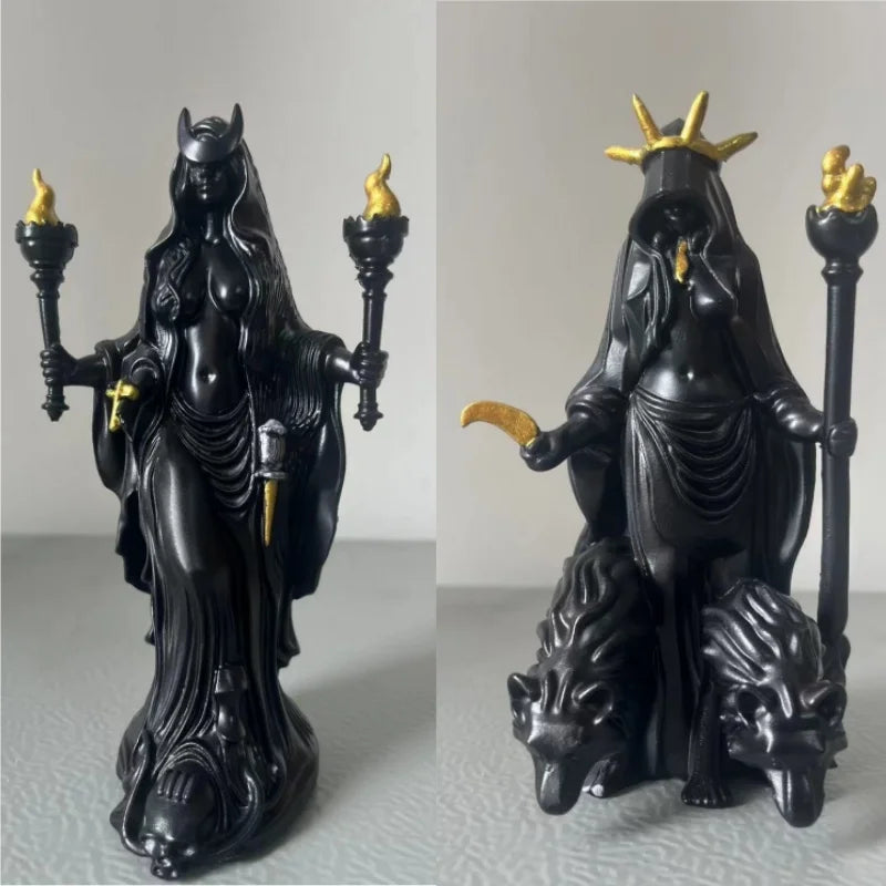 A black resin statue of a dark fantasy goddess with horns and mystical details.