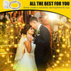 A bride and groom are illuminated by warm fairy lights creating a romantic atmosphere.