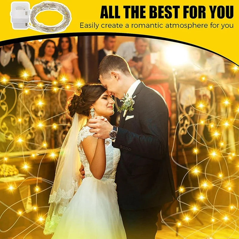 A bride and groom are illuminated by warm fairy lights creating a romantic atmosphere.