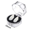 Clear plastic case with a lid open displaying realistic white vampire fangs