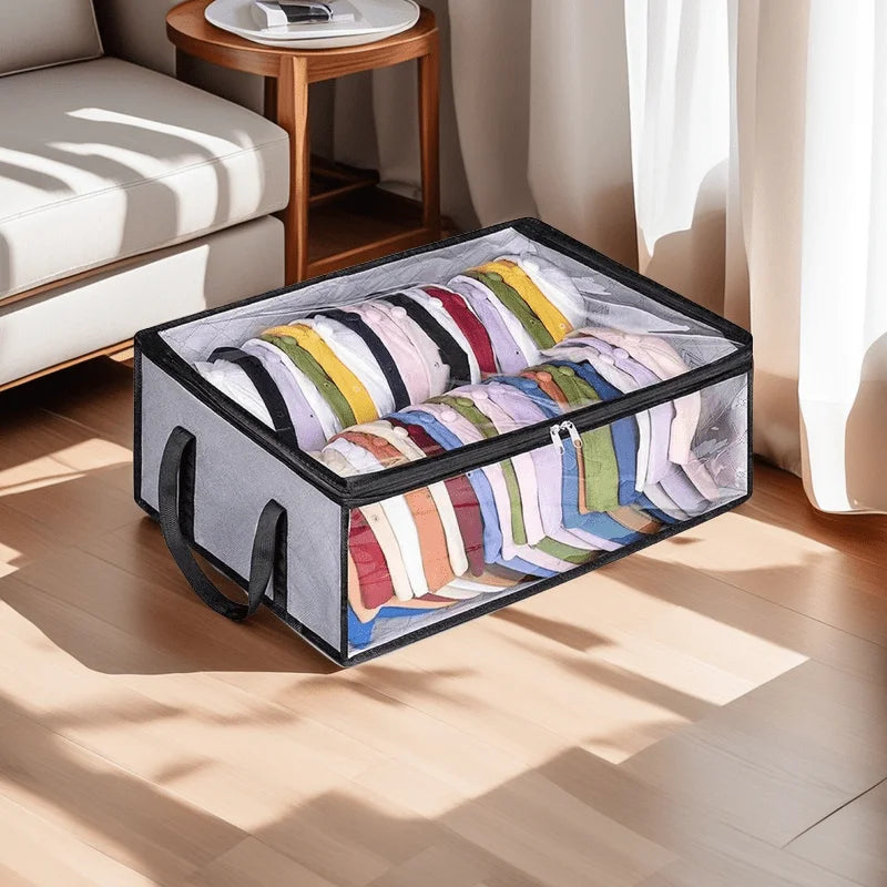 A gray foldable hat storage box with a clear viewing window filled with colorful folded hats on a wooden floor.