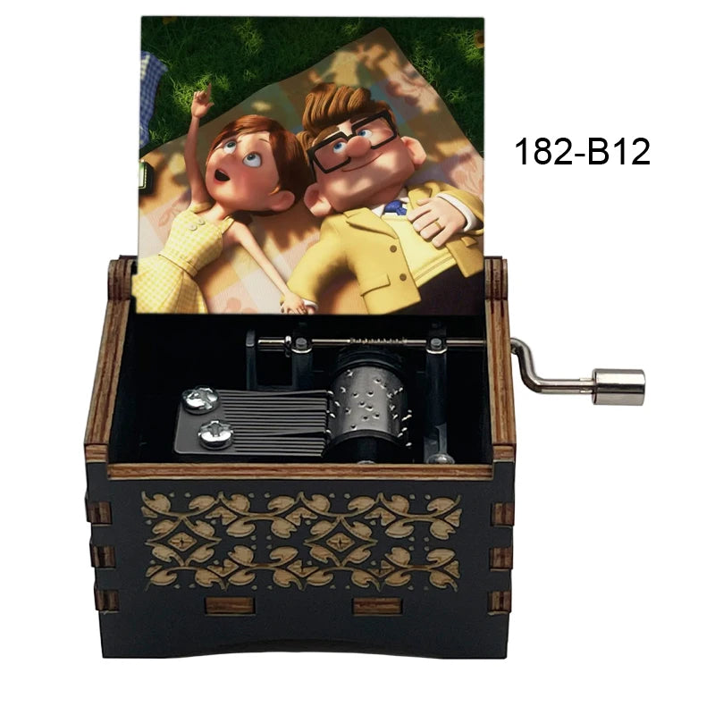 A wooden music box with a hand crank, featuring an illustration of a couple.