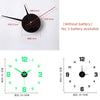 A black frameless acrylic digital wall clock showing the time and battery information.