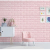 Pink textured brick wall panels with white furniture and a pink chair in a bright room.