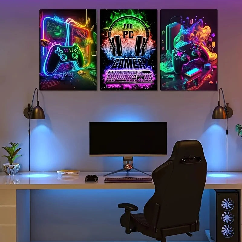 Three neon-themed canvas prints featuring retro gaming controllers and text displayed above a modern desk setup.