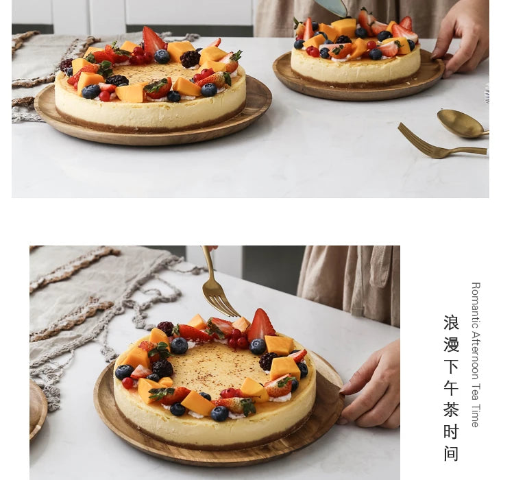 A slice of fruit tart decorated with berries and citrus served on a wooden tray.